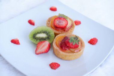 cake with delicious strawberry and kiwi