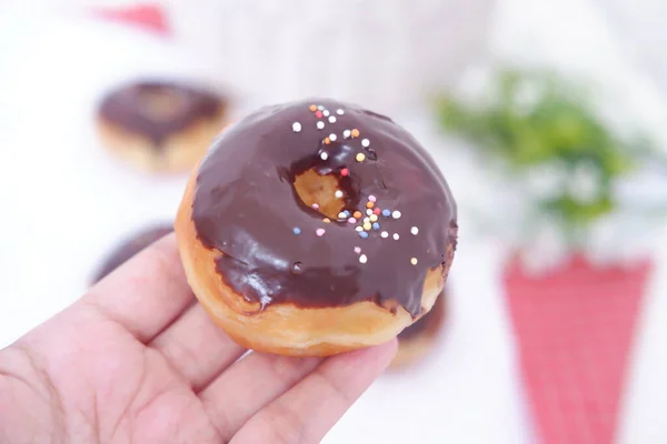 donuts with delicious chocolate coating as a background