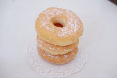 delicious snow donuts as a background