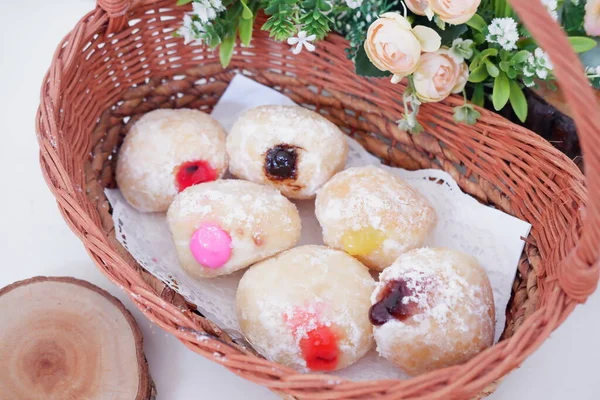 delicious flavor filled ball donuts as a background