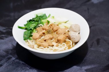 delicious meatball chicken noodle as a background