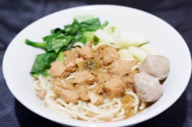 delicious meatball chicken noodle as a background