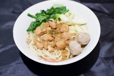 delicious meatball chicken noodle as a background