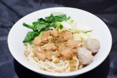 delicious meatball chicken noodle as a background