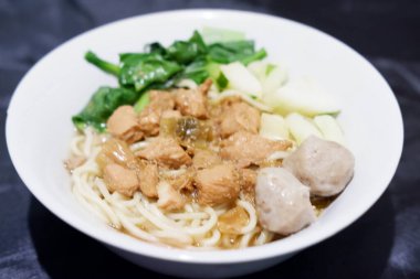 delicious meatball chicken noodle as a background