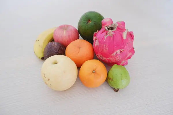 Fruits on a wooden table. Colorful fruits on a wooden table.
