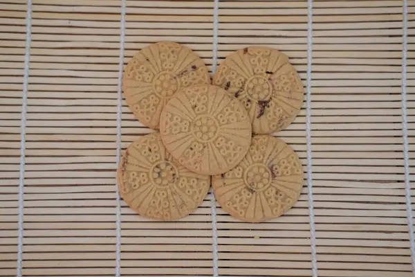 stock image cookies on a bamboo mat, shallow depth of field.