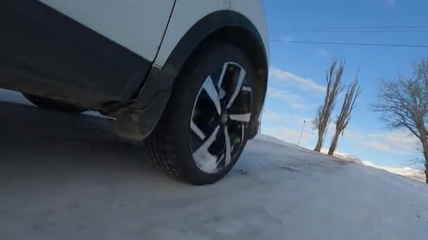 Traveling Car Winter Close Rear Front Wheels Suv White Car — Vídeo de stock