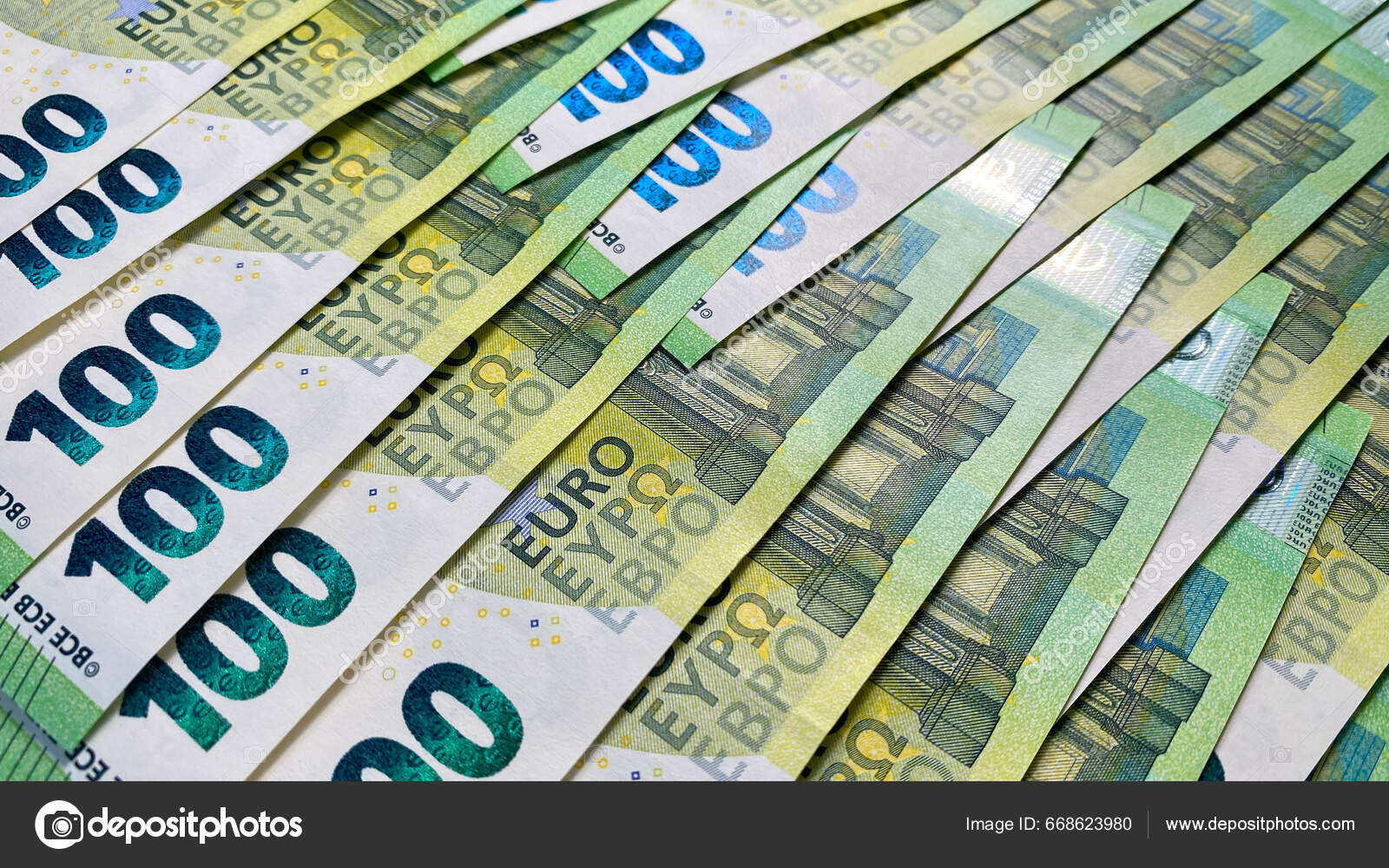 欧元货币背景欧洲联盟的单一货币100欧元的钞票100欧元钞票的背景欧洲货币现金现钞金融业务背景概念—— 库存社论照片© chekat  #668623980
