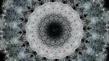 Bulanık, sürekli değişen dairesel bir model. Hayatın özünü yansıtıyor. Göz bebeği konsepti işte. Soyut bir kaleydoskop. Geçmişin ve geleceğin değişimi. Beyaz Büyü