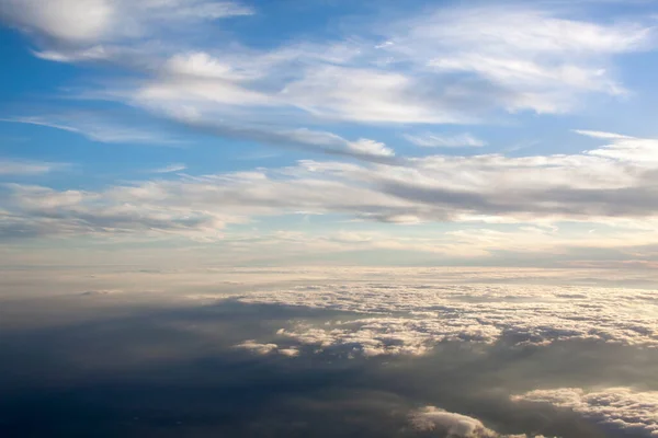 stock image The aerial scenic view of high altitude sunset above clouds and over Germany.