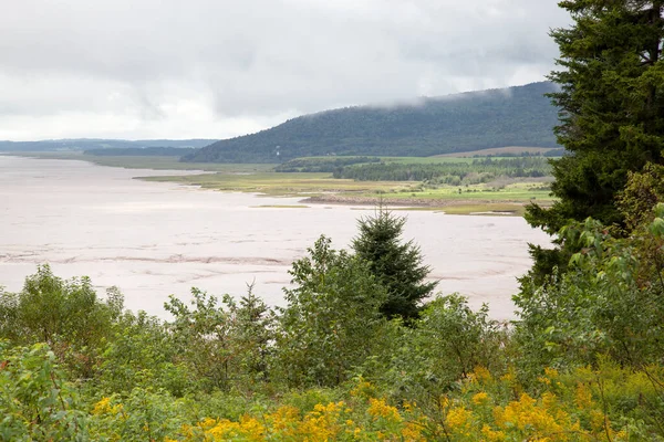 stock image The rainy clouds hanging over Demoiselle Beach, the coastline in New Brunswick famous for its very high tides (Canada).