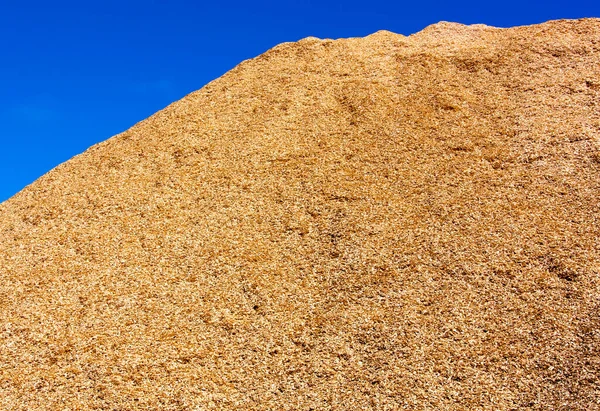 stock image The abstract view of a sawdust huge pile in contrast with a clear blue sky in Lautoka town (Fiji).