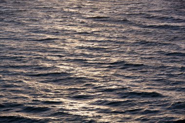 Melbourne 'da turuncu renkli gündoğumu dalgalarının soyut görüntüsü (Victoria).