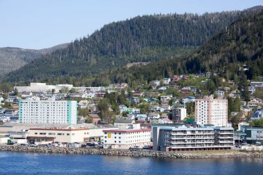 The aerial view of highest residential buildings in Ketchikan town surrounded by mountains (Alaska).