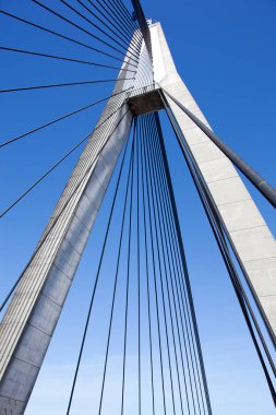The abstract view of Anzac cable-stayed bridge tower with a flag on a top in Sydney (New South Wales).