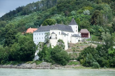 The view of historic Abbey Schonbuhel by Danube River in Wachau valley (Austria).