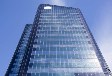 The abstract view of blue color glass covered skyscraper in Auckland downtown (New Zealand).