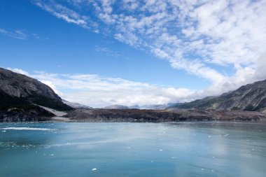 The scenic view of an old completely black glacier in Glacier Bay national park (Alaska).
