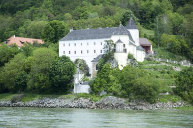 The view of historic Abbey Schonbuhel built by Danube River in Wachau region (Austria).