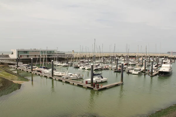  the marina with sailboats, ships and yachts in cadzand at the dutch coast in zeeland along the westerschelde sea
