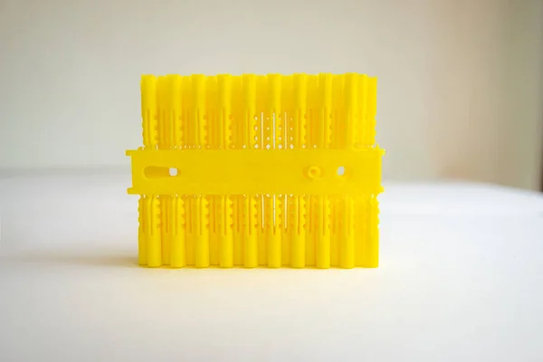 Bunch Yellow Plastic Raw Plug Supports Front View Isolated White — Stock Photo, Image