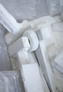 Detail objects printed on powder 3D printer and covered white polyamide powder close-up. Technology Multi Jet Fusion MJF. 3D prototype models created by new additive progressive 3d printing technology