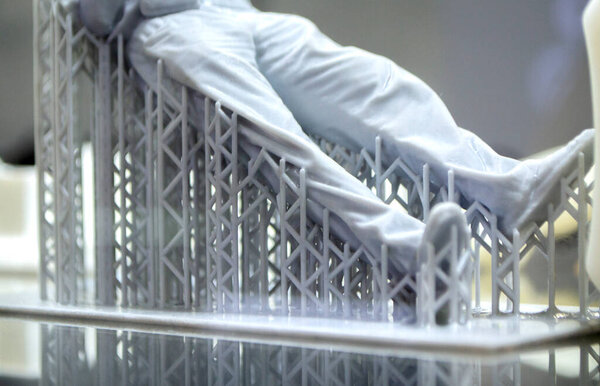 Model body of man printed on 3d printer. Object photopolymer printed on stereolithography 3D printer. Technology of liquid photopolymerization under UV light. New additive 3D printing technology