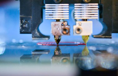 3d printer printing a model close-up. The process of printing a model on a 3D printer made of plastic.