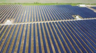 Solar power plant. Many blue panels of a large solar power plant. Aerial drone view. Solar power station. Green clean electricity. New modern technologies. Ecological alternative innovation technology