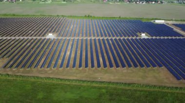 Solar power plant. Many blue panels of a large solar power plant. Aerial drone view. Solar power station. Green clean electricity. New modern technologies. Ecological alternative innovation technology