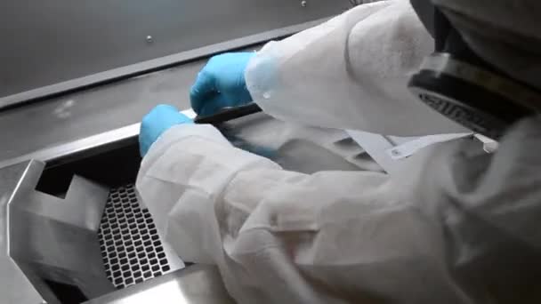 Laboratory Worker White Protective Suit Gloves Installing Metal Platform Work — Vídeo de stock