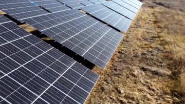 Solar power plant. Flight over modules of solar power station on sunny day. Alternative green electricity power. New modern technology. Renewable electrical energy. photovoltaic modules photobatteries