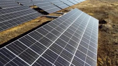 Solar power plant. Flight over modules of solar power station on sunny day. Alternative green electricity power. New modern technology. Renewable electrical energy. photovoltaic modules photobatteries