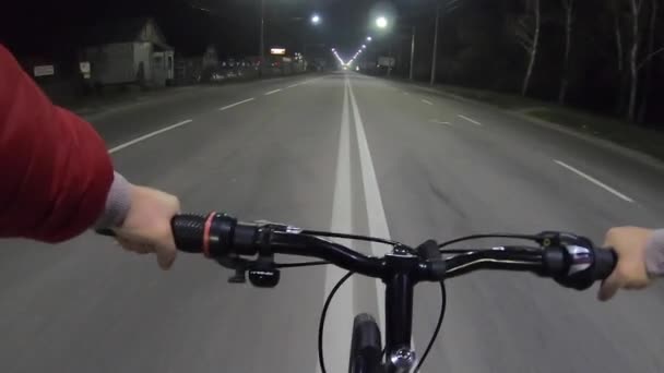 Person Riding Bicycle Center Automobile Paved Street Road Night City — Stock Video