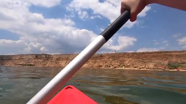 Man Floating Kayak Person Floats Red Kayak Paddles Rowing Oar — Stock Video