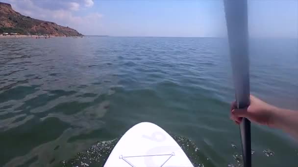 Man Floating Sup Board Person Floats White Sup Board Paddles — Stock Video