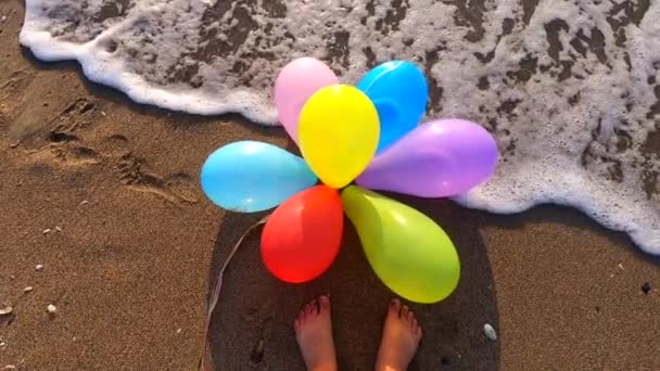 Bunch Multi Colored Balloons Lying Wet Sand Beach Seashore Rolling — Stock Video