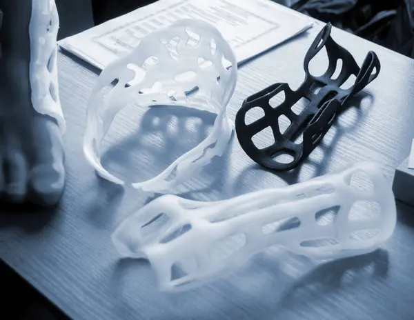 Hand and neck splint corset prosthesis langet printed on a 3D printer from molten plastic. Medical orthosis, fixator, plastic overlay created on 3D printer. New modern medical 3D printing technologies