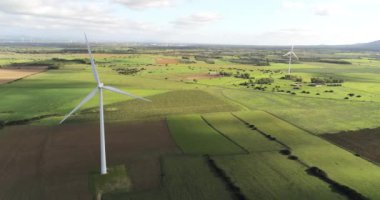 Wind turbines on a beautiful blue sky in a wind farm in the plain of southern Sardinia. Renewable energy concept, green energy generation