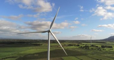Wind turbines on a beautiful blue sky in a wind farm in the plain of southern Sardinia. Renewable energy concept, green energy generation