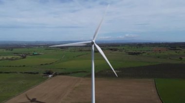 Wind turbines on a beautiful blue sky in a wind farm in the plain of southern Sardinia. Renewable energy concept, green energy generation