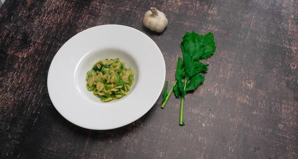 stock image Typical dish of Italian cuisine, orecchiette with turnip greens. Orecchiette with cime di rapa