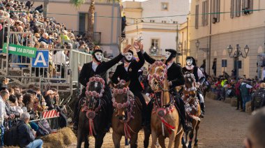 Oristano, Sardinia, ITALY - February 9th, 2024 -riders of the Sartiglia race directed by su componidori clipart