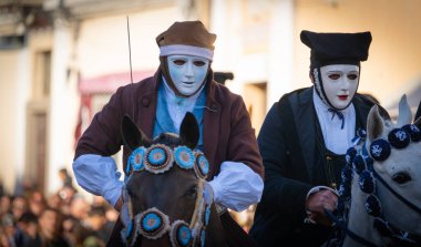 Oristano, Sardinia, ITALY - February 9th, 2024 -riders of the Sartiglia race directed by su componidori clipart