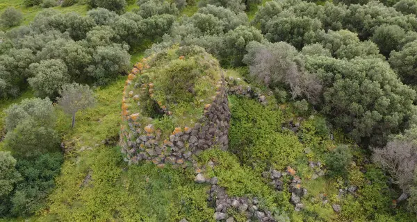 Stock image domus de janas and nuraghe of santu Barbara ancient nuragic tombs in Bauladu sardinia central