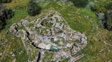 ruins of a nuraghe seen from above taken during excavations clipart