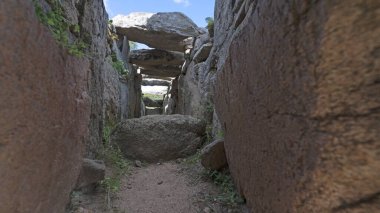 Archeological ruins of Nuragic necropolis Giants Tomb of Coddu Vecchiu - arzachena clipart