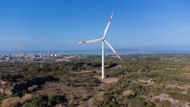 wind turbine moving in the wind farm in Sardinia clipart