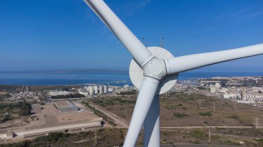 wind turbine moving in the wind farm in Sardinia clipart